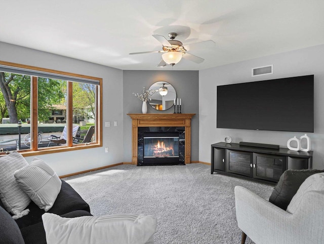 1306 Neponset Trl, Monona, WI 53716 - living area featuring baseboards, carpet flooring, and a ceiling fan