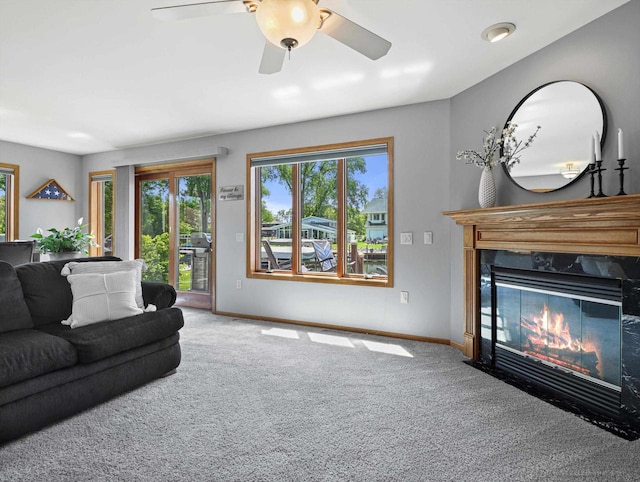 1306 Neponset Trl, Monona, WI 53716 - living room featuring carpet flooring, baseboards, a fireplace, and ceiling fan