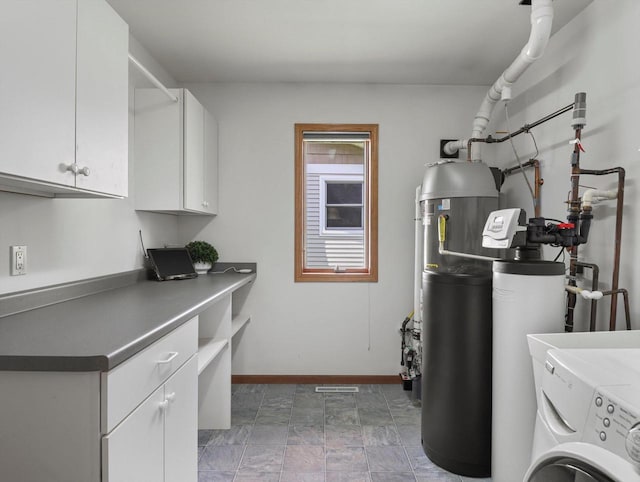 1306 Neponset Trl, Monona, WI 53716 - laundry room featuring cabinet space, washer / clothes dryer, baseboards, and stone finish flooring