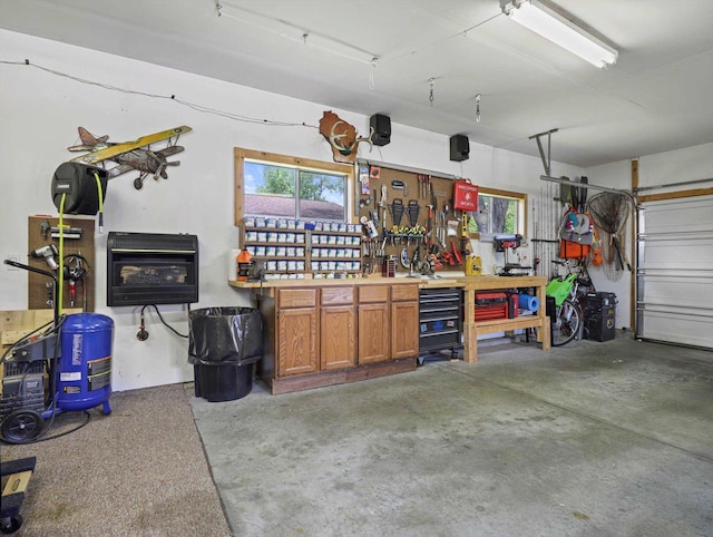 1306 Neponset Trl, Monona, WI 53716 - garage with a workshop area and heating unit