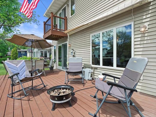 1306 Neponset Trl, Monona, WI 53716 - wooden terrace with an outdoor fire pit and outdoor dining area