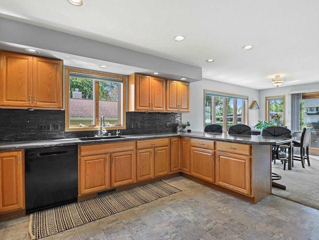 1306 Neponset Trl, Monona, WI 53716 - kitchen featuring black dishwasher, a sink, a peninsula, recessed lighting, and dark countertops