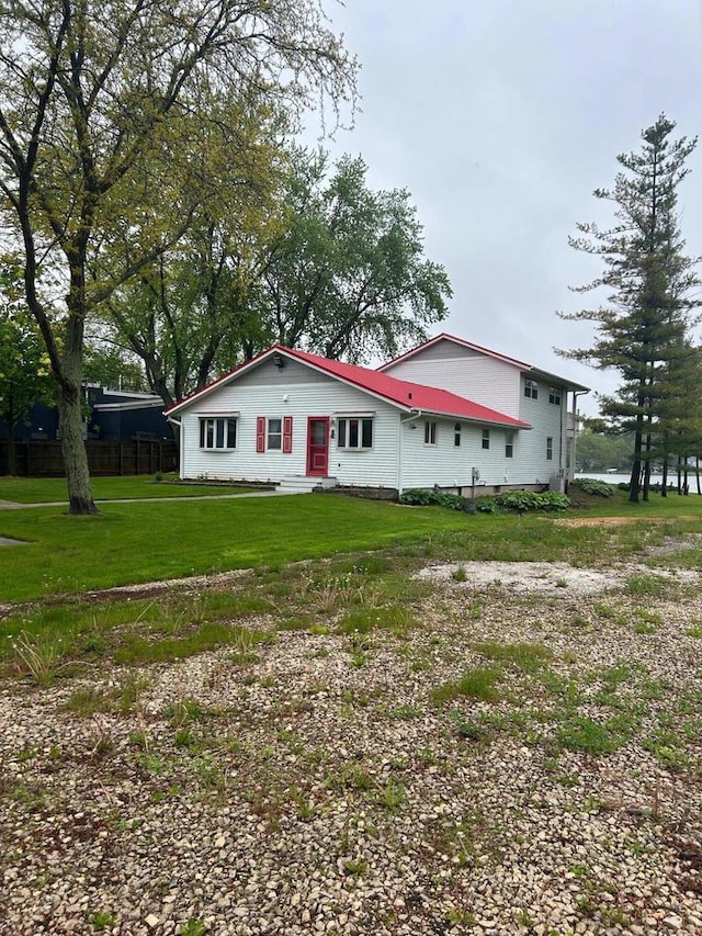 2462 Wallace Lake Rd, West Bend, WI 53090 - rear view of property with a lawn