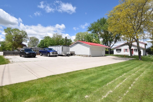 2462 Wallace Lake Rd, West Bend, WI 53090 - view of property exterior with an outbuilding, a yard, and a detached garage