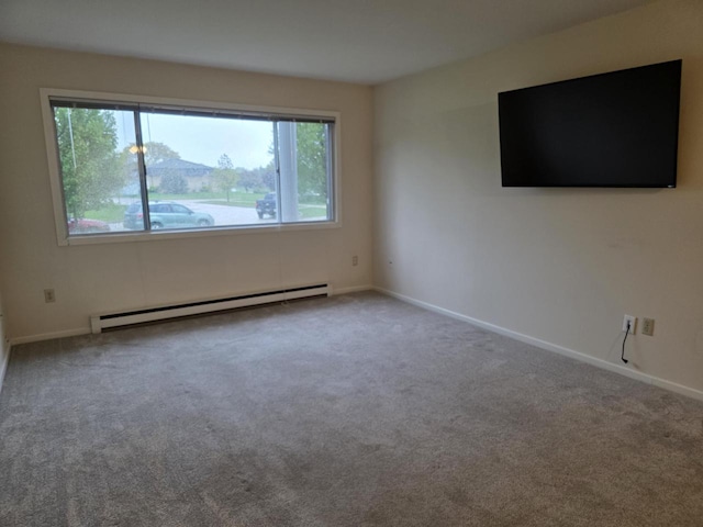10416 W Whitnall Edge Ct Unit 102, Franklin, WI 53132 - carpeted spare room featuring a baseboard radiator and baseboards