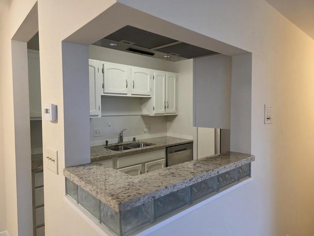 10416 W Whitnall Edge Ct Unit 102, Franklin, WI 53132 - kitchen featuring a sink, stainless steel dishwasher, white cabinets, light stone countertops, and a peninsula