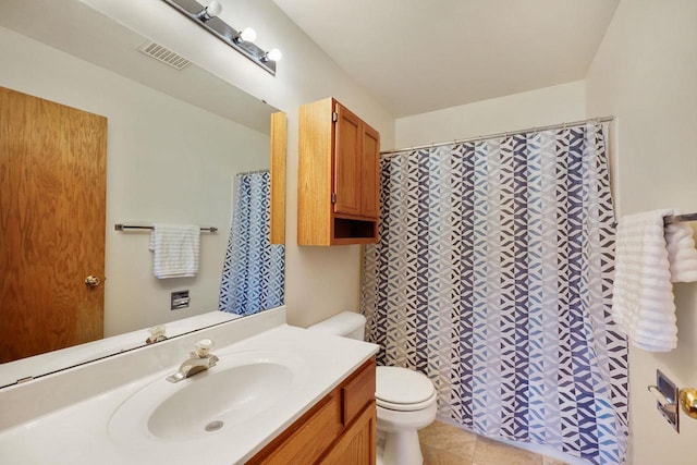 6911 Raymond Rd, Madison, WI 53711 - full bath featuring toilet, vanity, tile patterned floors, and a shower with curtain