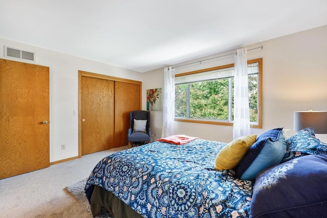 6911 Raymond Rd, Madison, WI 53711 - bedroom featuring carpet flooring, a closet, and baseboards