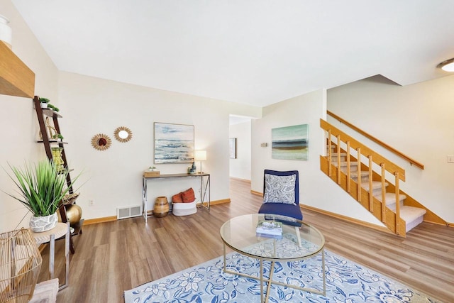 6911 Raymond Rd, Madison, WI 53711 - living room featuring stairs, wood finished floors, and baseboards
