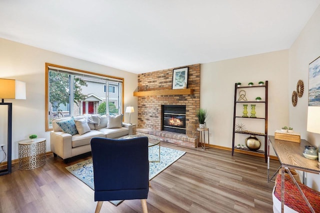 6911 Raymond Rd, Madison, WI 53711 - living room with wood finished floors, a fireplace, and baseboards