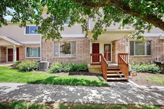 6911 Raymond Rd, Madison, WI 53711 - townhome / multi-family property featuring central AC and brick siding