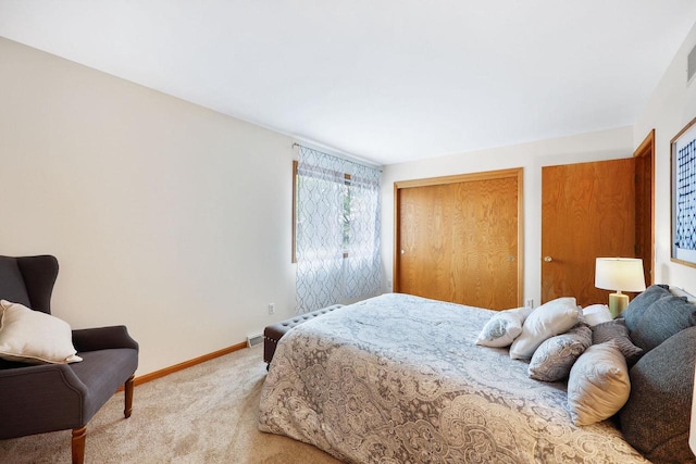 6911 Raymond Rd, Madison, WI 53711 - carpeted bedroom with baseboards and two closets