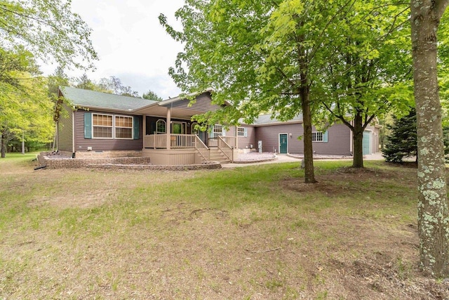 618 Little Fawn Dr, Nekoosa, WI 54457 - back of property featuring covered porch and a yard
