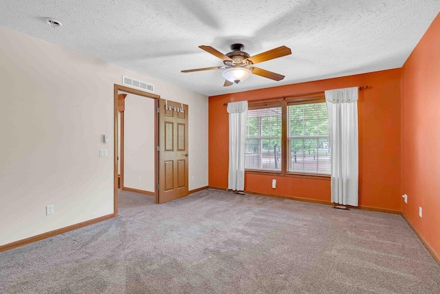 618 Little Fawn Dr, Nekoosa, WI 54457 - carpeted empty room featuring ceiling fan, baseboards, and a textured ceiling