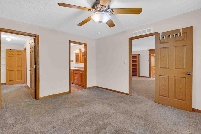 618 Little Fawn Dr, Nekoosa, WI 54457 - unfurnished bedroom featuring light colored carpet, baseboards, and ensuite bath
