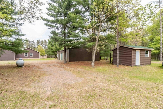 618 Little Fawn Dr, Nekoosa, WI 54457 - view of green lawn with an outbuilding