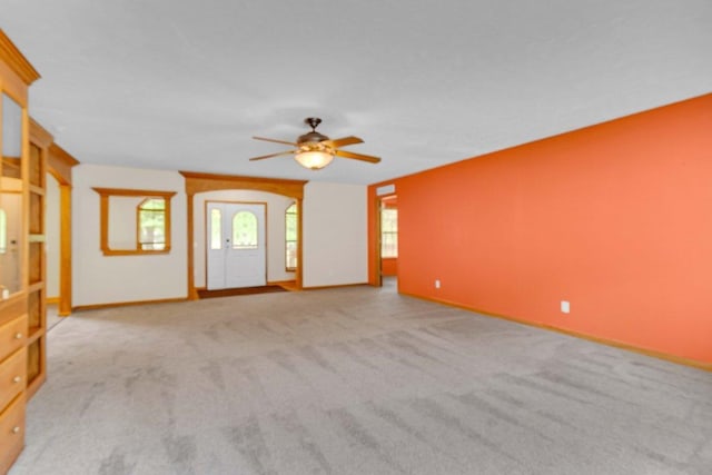 618 Little Fawn Dr, Nekoosa, WI 54457 - unfurnished living room featuring a ceiling fan, carpet flooring, and baseboards