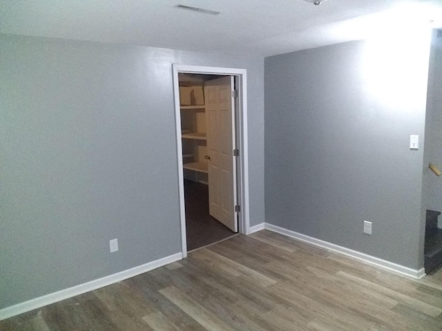 8594 W Villard Ave, Milwaukee, WI 53225 - unfurnished bedroom with wood finished floors and baseboards