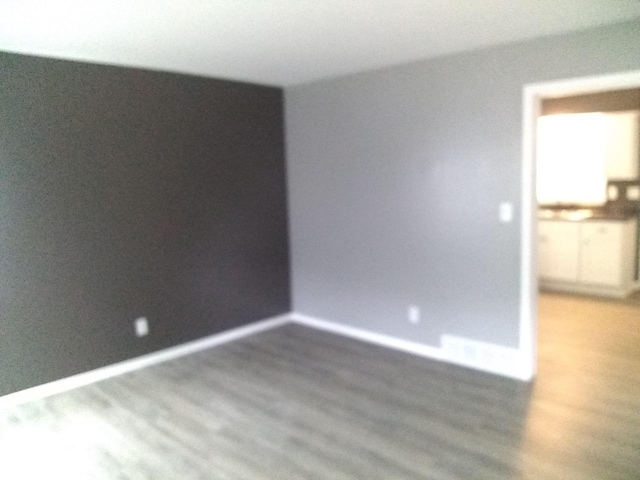 8594 W Villard Ave, Milwaukee, WI 53225 - unfurnished room with wood finished floors and baseboards