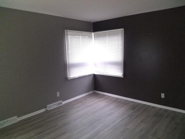 8594 W Villard Ave, Milwaukee, WI 53225 - empty room with dark wood-style flooring and baseboards