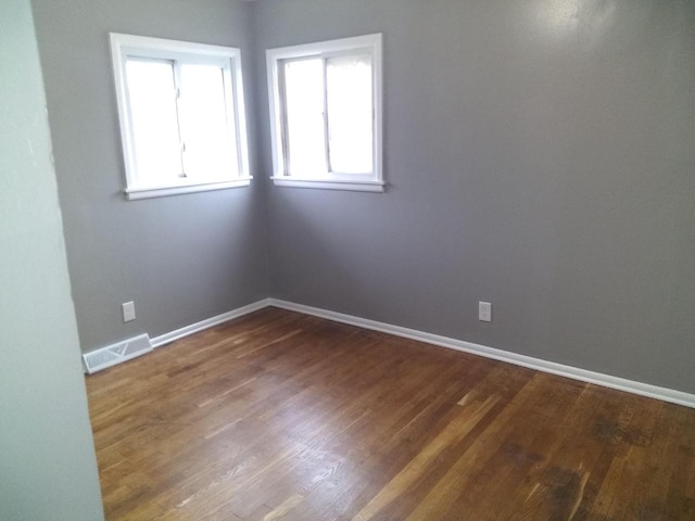 8594 W Villard Ave, Milwaukee, WI 53225 - spare room featuring baseboards and wood finished floors