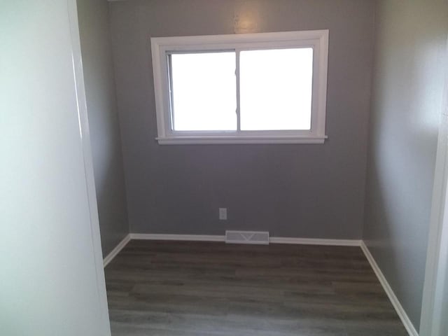 8594 W Villard Ave, Milwaukee, WI 53225 - unfurnished room with dark wood-style floors and baseboards