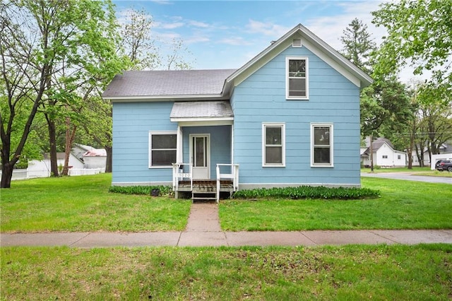 1020 E 10th St, Menomonie, WI 54751 - view of front of house featuring a front lawn