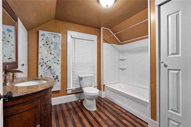 1020 E 10th St, Menomonie, WI 54751 - full bath with vaulted ceiling, toilet, vanity, and tub / shower combination