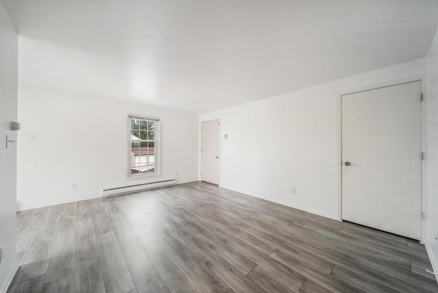 3933 Country Pl Unit D, Sheboygan, WI 53081 - spare room with baseboard heating and wood finished floors