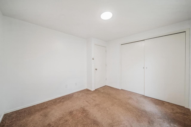 3933 Country Pl Unit D, Sheboygan, WI 53081 - unfurnished bedroom featuring carpet floors, a closet, and baseboards