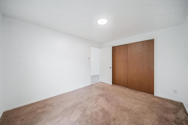 3933 Country Pl Unit D, Sheboygan, WI 53081 - unfurnished bedroom with carpet, a closet, and baseboards