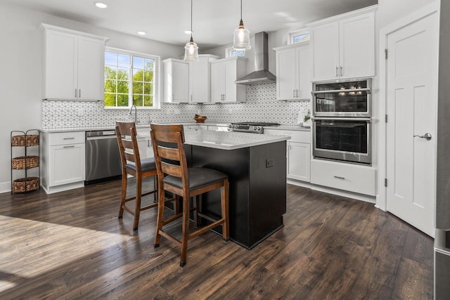 W239N7521 High Ridge Dr, Sussex, WI 53089 - kitchen with wall chimney range hood, stainless steel appliances, light countertops, recessed lighting, and backsplash