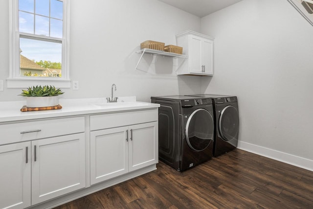 W239N7521 High Ridge Dr, Sussex, WI 53089 - laundry room with cabinet space, separate washer and dryer, dark wood-type flooring, and baseboards