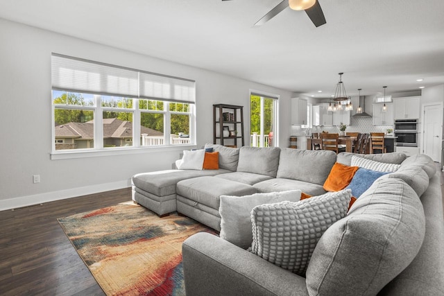 W239N7521 High Ridge Dr, Sussex, WI 53089 - living area with ceiling fan, baseboards, recessed lighting, dark wood-type flooring, and a chandelier