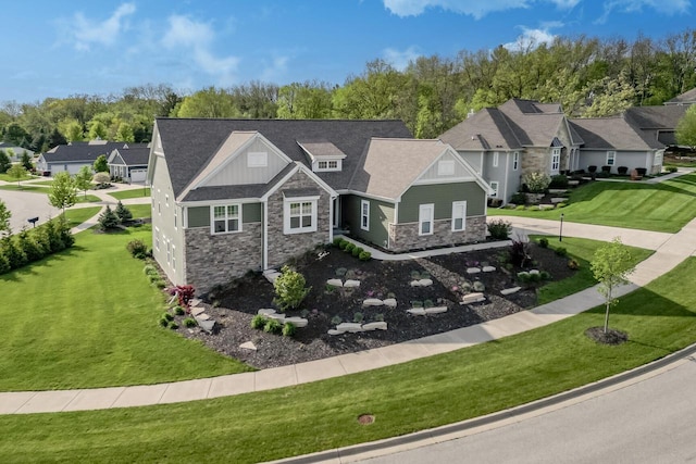 W239N7521 High Ridge Dr, Sussex, WI 53089 - view of front of house featuring stone siding, a residential view, and a front yard
