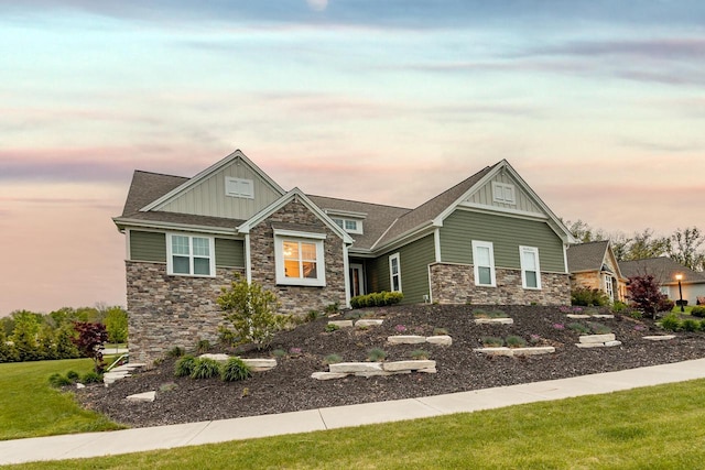 W239N7521 High Ridge Dr, Sussex, WI 53089 - craftsman-style house featuring board and batten siding, stone siding, and a yard