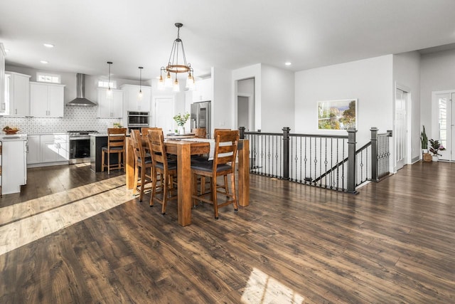 W239N7521 High Ridge Dr, Sussex, WI 53089 - dining area with dark wood-type flooring and recessed lighting