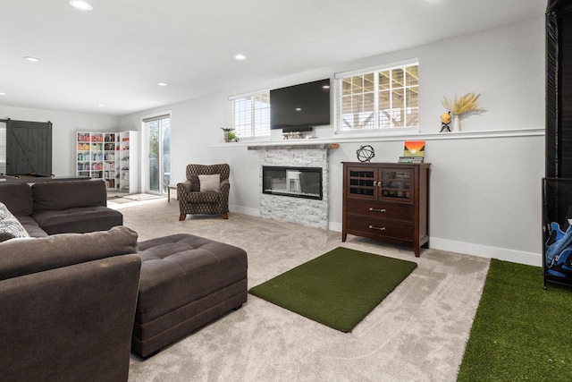 W239N7521 High Ridge Dr, Sussex, WI 53089 - carpeted living room featuring a fireplace, recessed lighting, baseboards, and a barn door