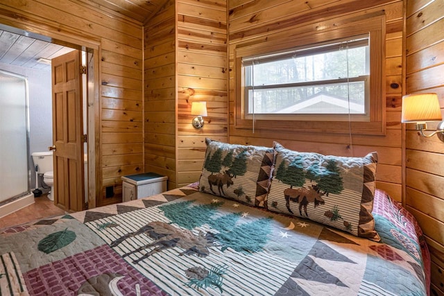 134 Glen View Dr Unit 44, Wisconsin Dells, WI 53965 - bedroom featuring wood walls, connected bathroom, and wood finished floors
