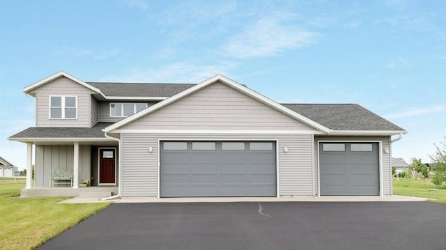 20170 63rd Ave, Chippewa Falls, WI 54729 - view of front of house featuring an attached garage, asphalt driveway, and roof with shingles