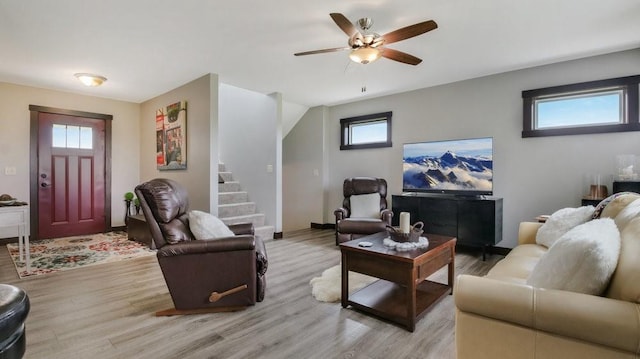 20170 63rd Ave, Chippewa Falls, WI 54729 - living room featuring light wood-style floors, plenty of natural light, a ceiling fan, and stairway