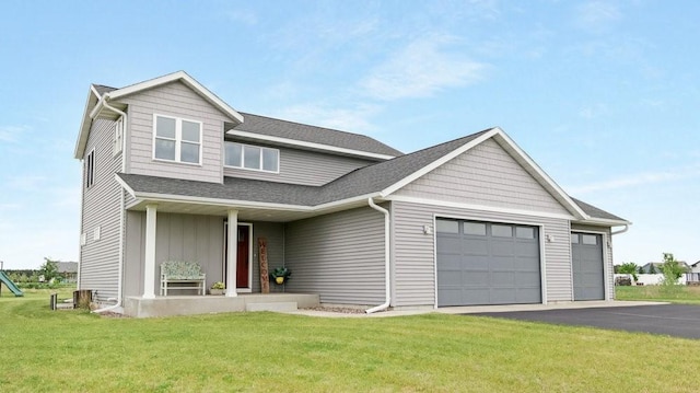 20170 63rd Ave, Chippewa Falls, WI 54729 - view of front of home with an attached garage, a front lawn, asphalt driveway, and a shingled roof