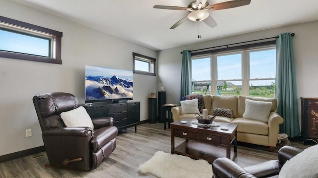 20170 63rd Ave, Chippewa Falls, WI 54729 - living area featuring a ceiling fan, wood finished floors, and baseboards