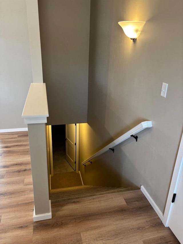 1236 Northwood Dr, Seymour, WI 54165 - staircase featuring wood finished floors and baseboards
