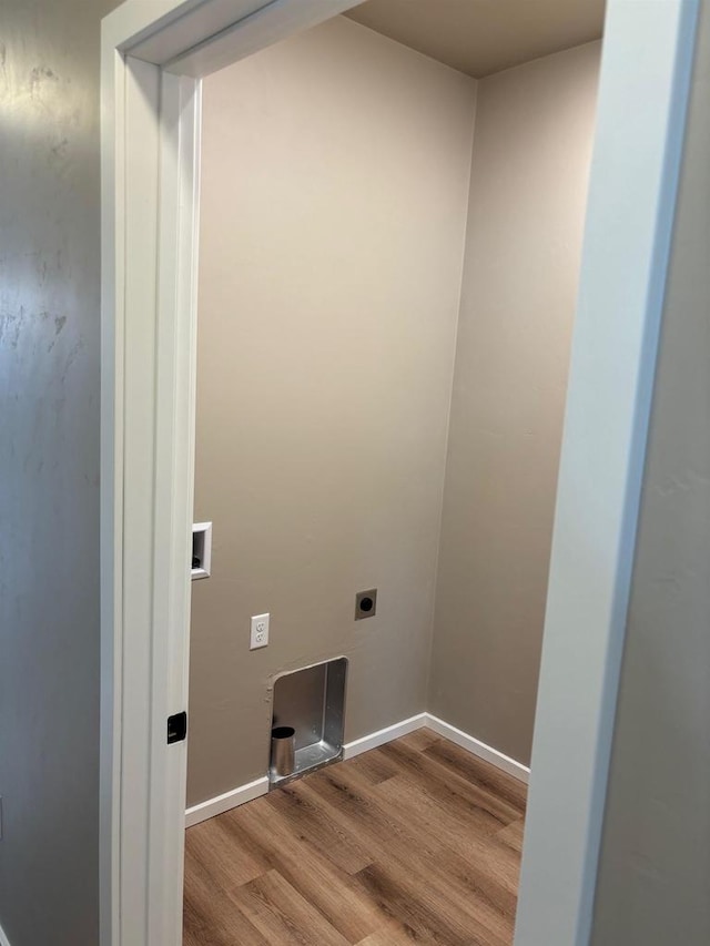 1236 Northwood Dr, Seymour, WI 54165 - laundry area with hookup for an electric dryer, wood finished floors, and baseboards
