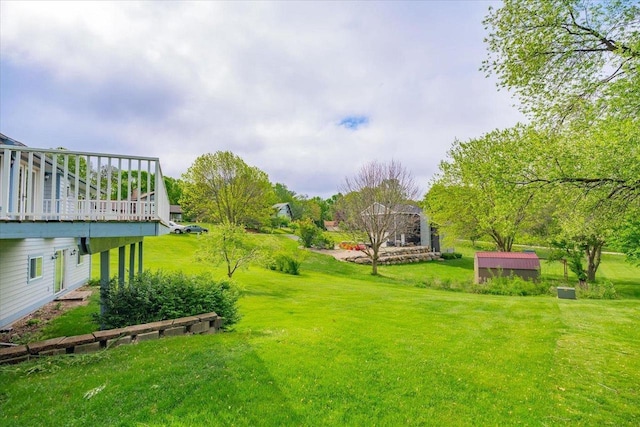 S7635 High Point Dr, Merrimac, WI 53561 - view of green lawn with a wooden deck