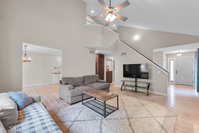 5806 E Open Mdw, Mcfarland, WI 53558 - living room with wood finished floors, high vaulted ceiling, stairs, a ceiling fan, and baseboards