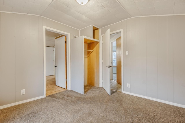 415 Ferry St, La Crosse, WI 54601 - unfurnished bedroom featuring lofted ceiling and carpet