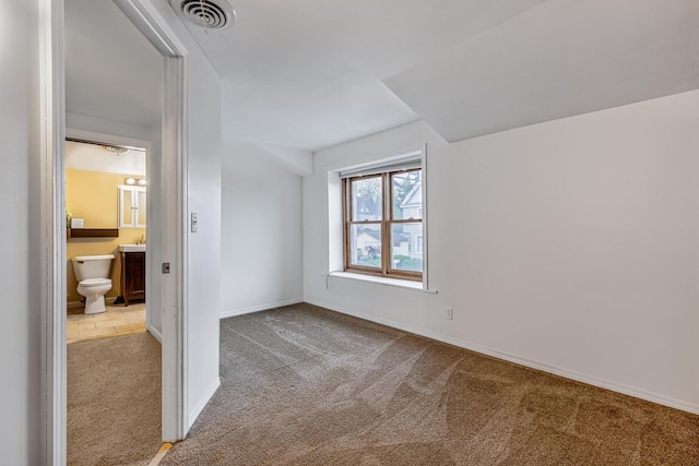 415 Ferry St, La Crosse, WI 54601 - unfurnished bedroom featuring carpet floors, baseboards, and ensuite bathroom