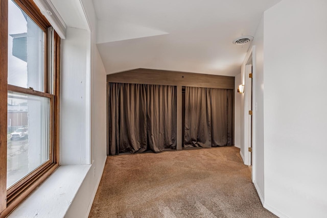 415 Ferry St, La Crosse, WI 54601 - additional living space featuring carpet flooring and vaulted ceiling